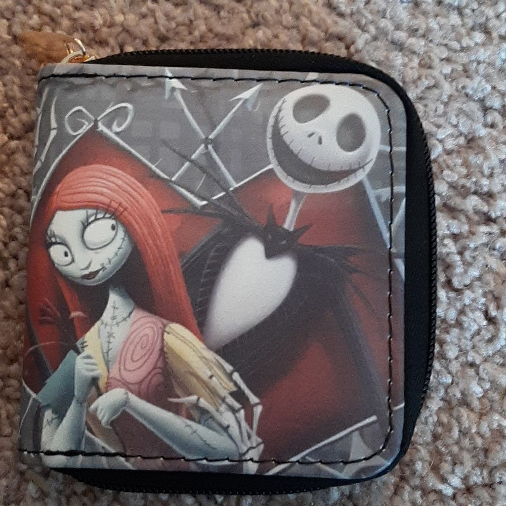 NWOT Nightmare Before Christmas short wallet with zippered closure.